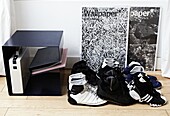 Sports shoes and filing unit in contemporary London home   England   UK