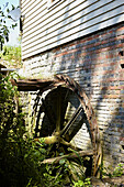 Old iron water-wheel at exterior of rural United Kingdom