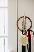 Tape measure and ribbon hang in Faversham studio,  Kent,  UK