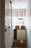 Striped roman blinds in laundry room of Bolton home,  Greater Manchester,  England,  UK