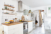 White fitted kitchen with oven and extractor in London home  UK