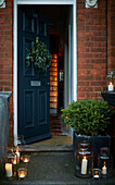 Lit candles and tealights on doorstep of Rochester home  Kent  UK