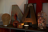 Letters 'A' and 'N' with vintage storage tins and dolls heads  Rochester  Kent  UK