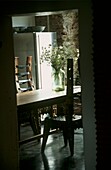 View into dining room with handcrafted wooden chairs