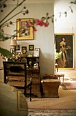 Antique writing desk in drawing room with life size portrait painting