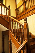 Central wooden staircase in inner hall