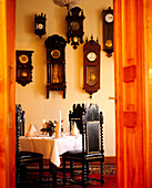 Display of antique wall clocks in restaurant