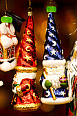 Hanging Santa bauble decorations on display at a Christmas market in Krakow