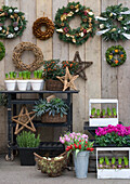 Christmas wreaths and plant shop bulbs on trolley