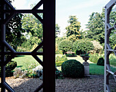 View through open door to 16th century Suffolk house garden