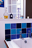 Purple and blue tiled splashback on bathroom sink