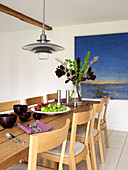 Modern dining room with picture on the wall