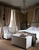 Old-fashioned bedroom with double bed with canopy