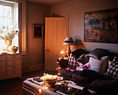 Cozy living room interior illuminated with christmas lighting