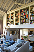 Elevated bookcase in barn conversion Wiltshire
