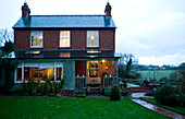 Brick exterior of detached Hereford home in winter