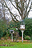 Dovecote and bird house in grounds of Forest Row country house, Sussex, England, UK