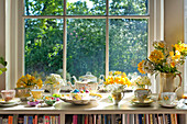 Easter eggs and crockery on sunlit windowsill of Essex home, England, UK