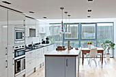 Kitchen island in white fitted kitchen of Wadebridge home, Cornwall, England, UK