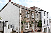 Stone and whitewashed cottages in coastal village of Padstow, Cornwall, England, UK