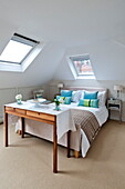 Skylights in attic bedroom of Middlesex family home, London, England, UK