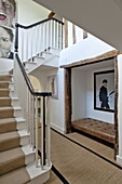 brown leather recessed seating in entrance hallway of contemporary Suffolk/Essex home, England, UKB