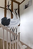 Ostrich ornaments in staircase of contemporary Suffolk/Essex timber framed home, England, UK
