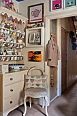 Chinaware hanging in kitchen dresser at doorway in London home, England, UK