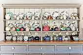 Wall mounted china cabinet in rural Blagdon home, Somerset, England, UK
