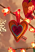 Heart shaped decoration with single word 'joy' in Penzance cottage Cornwall England UK