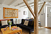 Vintage sign for Lyons' Tea in reception room of family townhouse Cornwall England UK