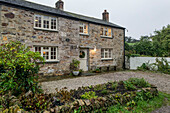 Gravel driveway of granite and slate Georgian cottage St Erth Cornwall UK