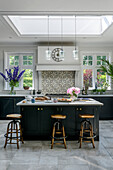 Tiled splashback in kitchen extension of grade II-listed Victorian family home Godalming Surrey UK