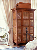 Bedroom with rattan cupboard