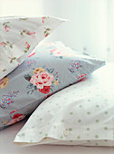 Detail of floral rose printed and polka dot pillowcases 