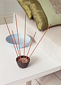 Incense sticks and cushions in living room