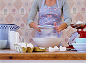 Woman home baking on kitchen table