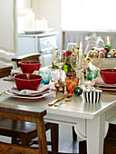 Red bowls at place settings on table for Christmas dinner