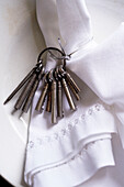 Silver keys and linen napkin