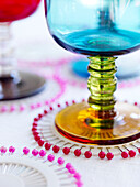 Wineglass on coaster made of pins