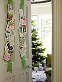 Christmas cards displayed on ribbon