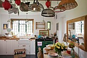 Kitchenware in sunlit Cranbrook family home, Kent, England, UK