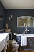 Architectural salvage and old tin bath in timber framed cottage, Grafty Green, Kent, England, UK