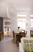 Open plan dining room and kitchen in St Leonards beach house, East Sussex, England, UK