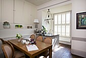 Sunlit kitchen and dining area with built-in storage in Cranbrook home, Kent, England, UK