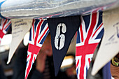 Nautical bunting with Union Jack and number six on the Picnic Boat Dartmouth Devon England UK