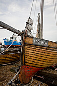Wooden fishing boat on shingle beach at Deal in Kent England UK