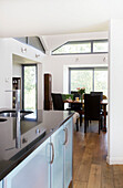 Open plan dining room and kitchen of Rolvenden water tower conversion Cranbrook Kent England UK