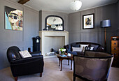 Seating area with modern artwork canvas in living room of Old Town townhouse Portsmouth England UK