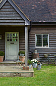 Front step porchway of wooden panelled Kent home England UK